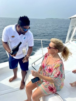 me on boat with a glass of champagne